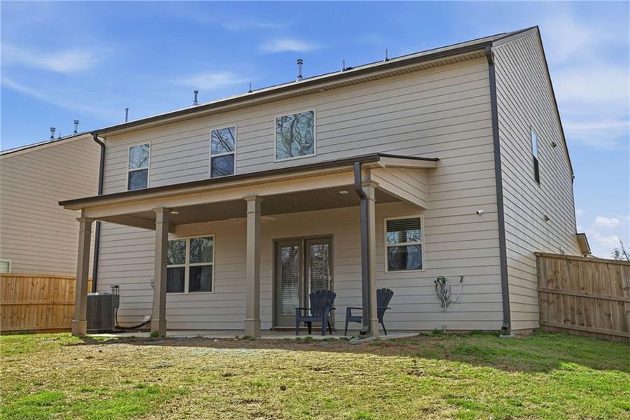 Exterior details and patio area of a home in The Enclave at Flat Rock Hills, Stonecrest (Image 3).