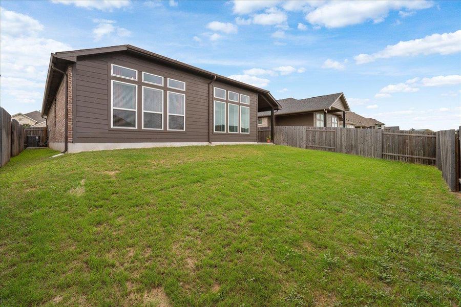 Front exterior of a new home in , Buda, TX, highlighting curb appeal (Image 19). Front exterior of a new home in , Buda, TX, highlighting curb appeal (Image 19).