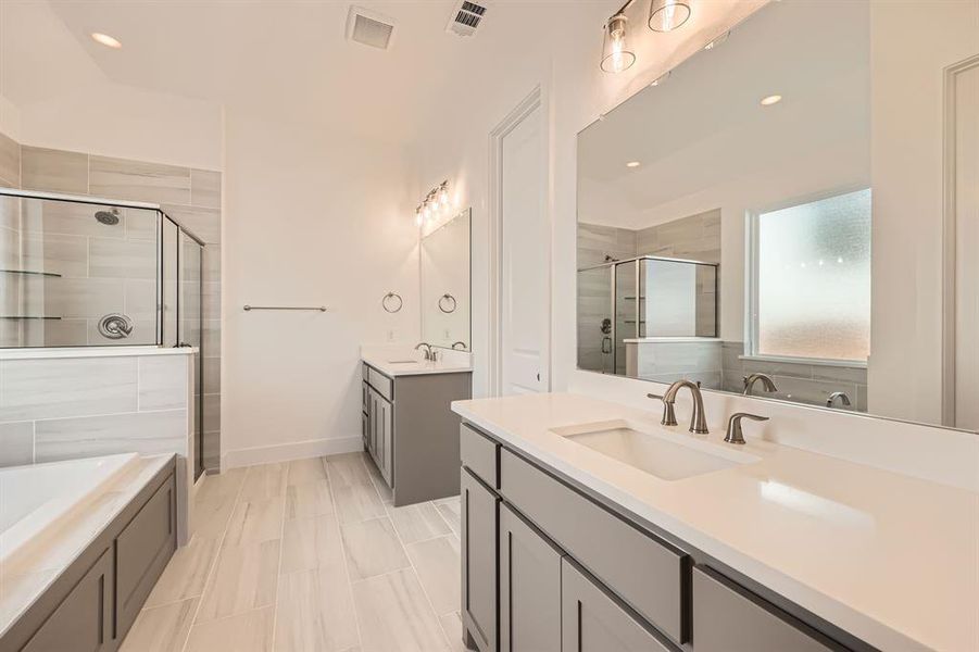 Bathroom with vanity and plus walk in shower