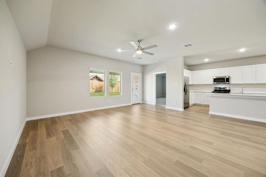 Open Floor Plan in the Oscar home plan by Trophy Signature Homes – REPRESENTATIVE PHOTO