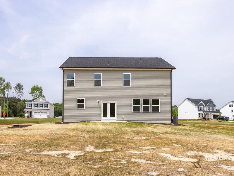 Exterior details and patio area of a home in Woodland Crossing, Zebulon (Image 2).
