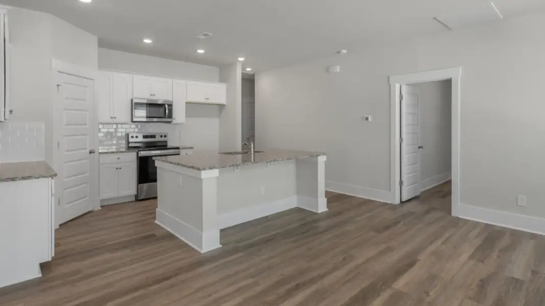 Furnished interior view inside a new home in The Retreat at Indigo Preserve Townhomes, Leland (Image 8).