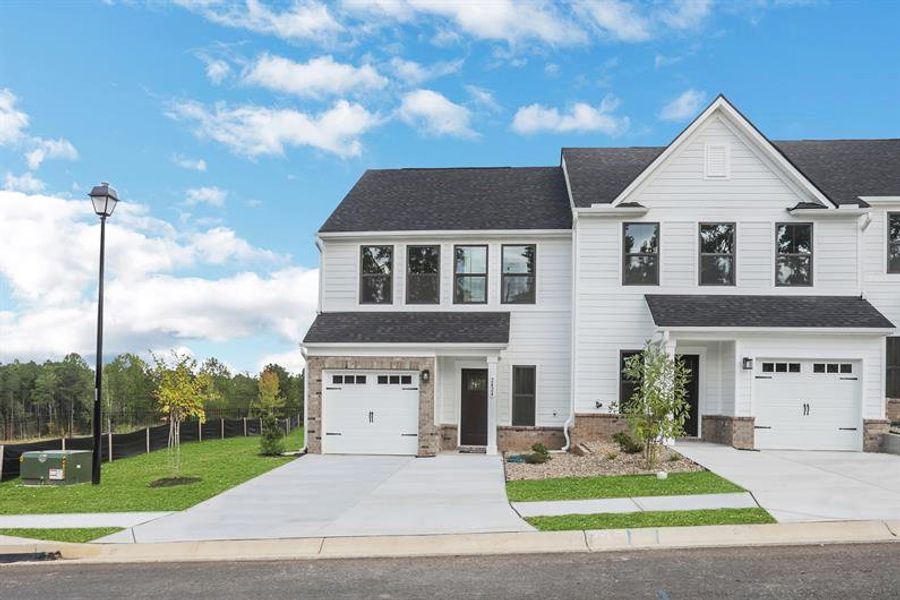 Front exterior of a new home in Laurel Fields, Gainesville, GA, highlighting curb appeal (Image 23).
