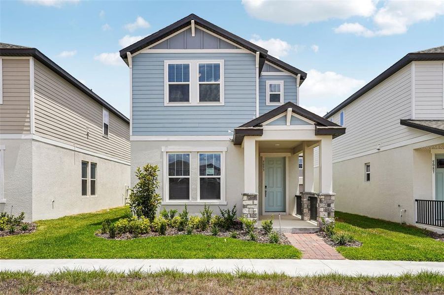 Front exterior of a new home in Silverleaf Reserve Bungalows, Winter Garden, FL, highlighting curb appeal (Image 1). Front exterior of a new home in Silverleaf Reserve Bungalows, Winter Garden, FL, highlighting curb appeal (Image 1).