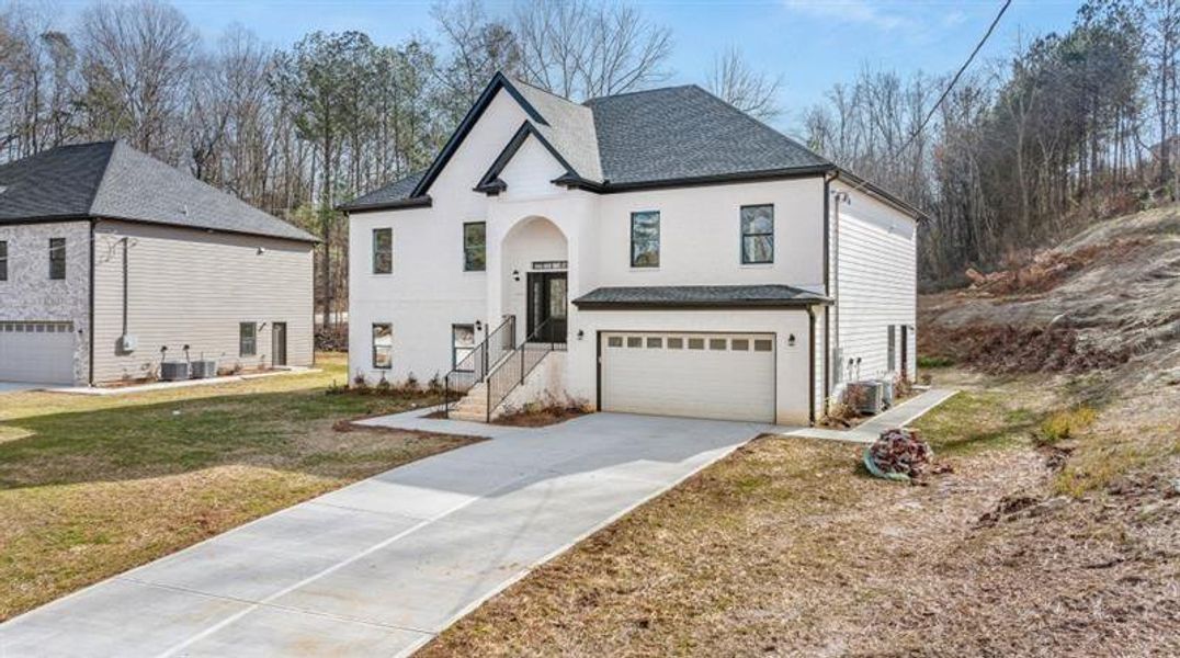 Front exterior of a new home in , Snellville, GA, highlighting curb appeal (Image 1).