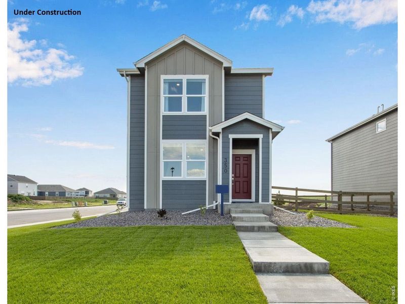 Front exterior of a new home in Tailholt, Severance, CO, highlighting curb appeal (Image 2). Front exterior of a new home in Tailholt, Severance, CO, highlighting curb appeal (Image 2).