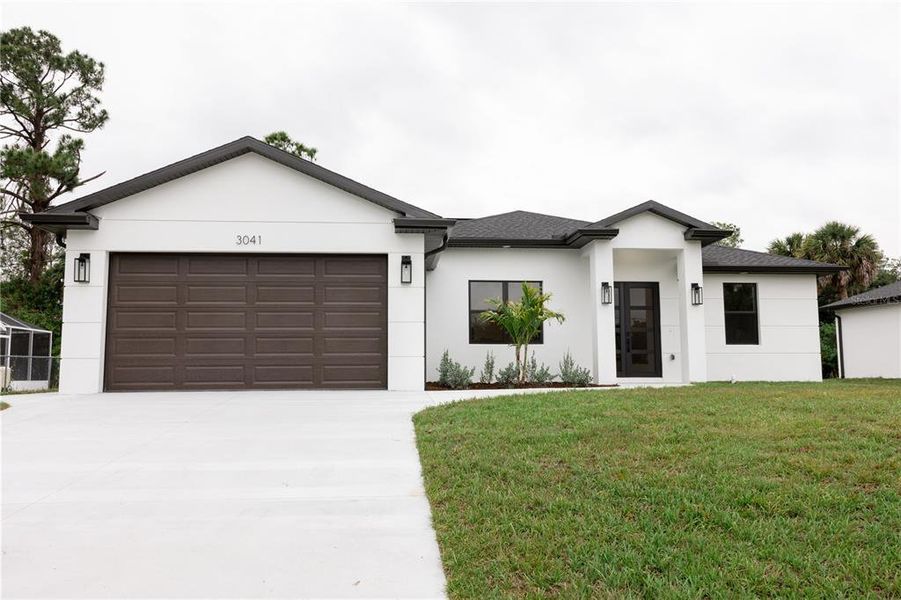 Front exterior of a new home in , North Port, FL, highlighting curb appeal (Image 22).