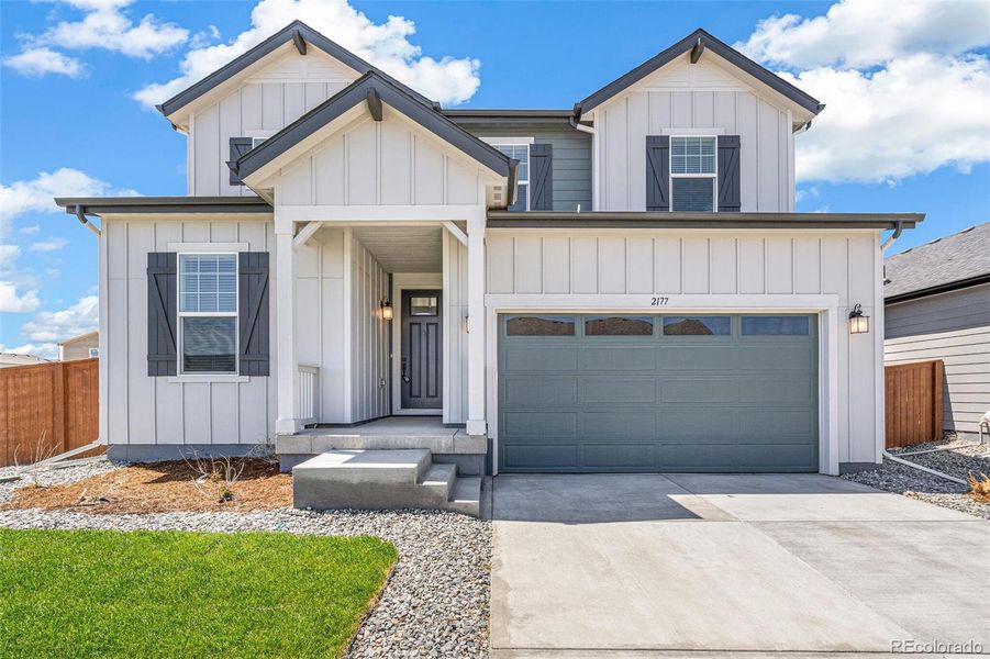 Front exterior of a new home in Farmlore, Brighton, CO, highlighting curb appeal (Image 19).