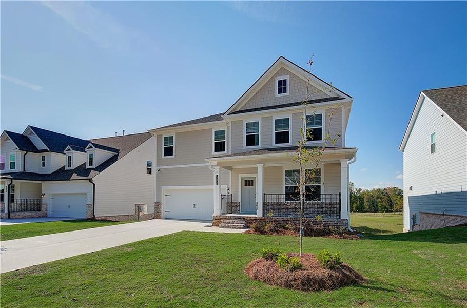 Front exterior of a new home in Cooper Park, McDonough, GA, highlighting curb appeal (Image 15).