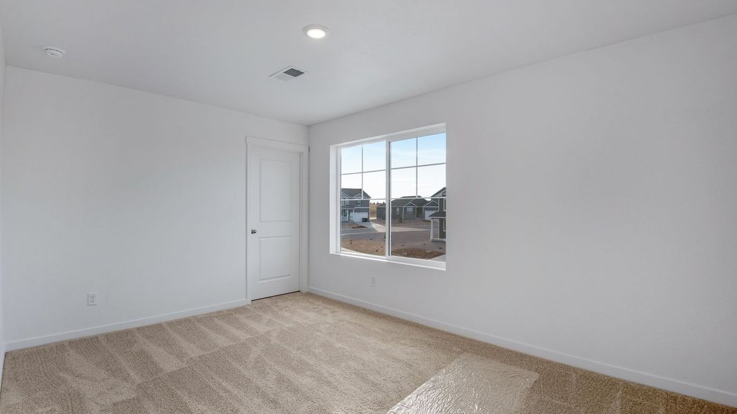 Spacious, unfurnished interior of a new home in Silver Peaks, Lochbuie (Image 34).