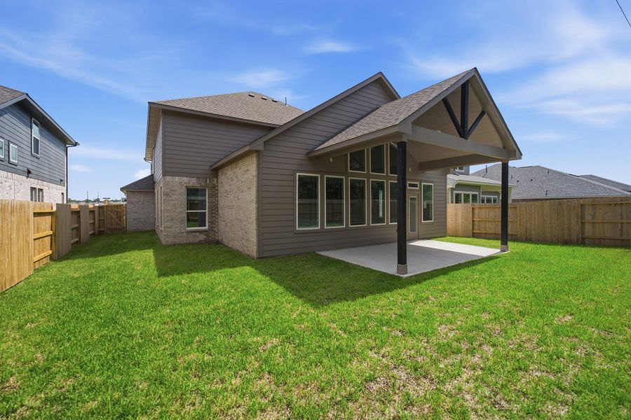 Exterior details and patio area of a home in Sundance Cove, Crosby (Image 28).