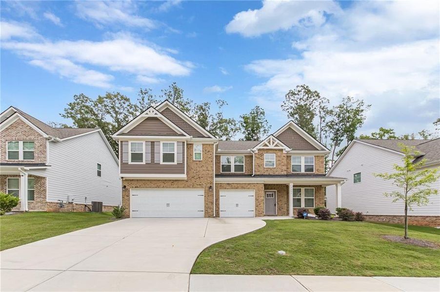 Front exterior of a new home in Twin Shoals, Atlanta, GA, highlighting curb appeal (Image 1). Front exterior of a new home in Twin Shoals, Atlanta, GA, highlighting curb appeal (Image 1).