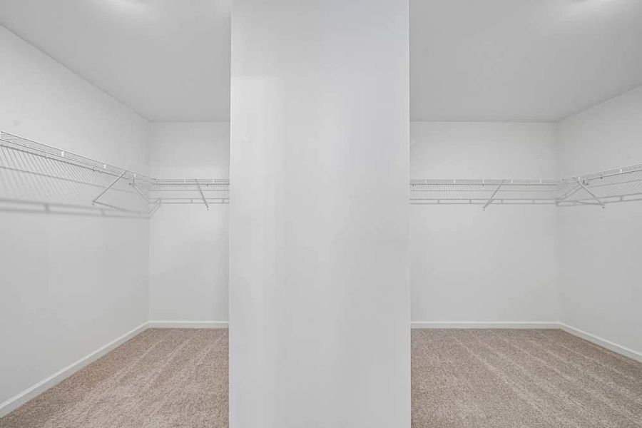 Representative Photo: Primary Bedroom Walk-In Closet