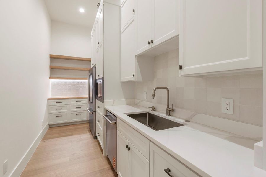 Gorgeous Butlers Pantry with separate sink, dishwasher and Costco door to garage