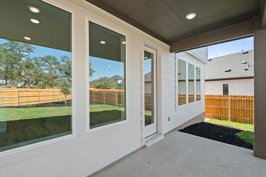 Exterior details and patio area of a home in Terrace Collection at Heritage, Dripping Springs (Image 19).