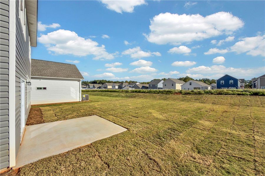 Exterior details and patio area of a home in Brownstone Park, Easley (Image 2).