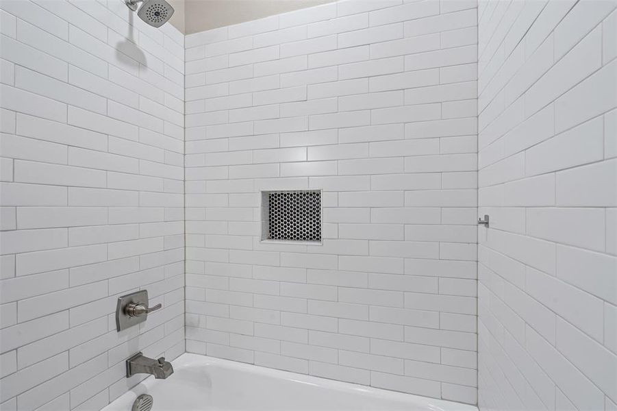 Bathroom with bathing tub / shower combination Bathroom with bathing tub / shower combination