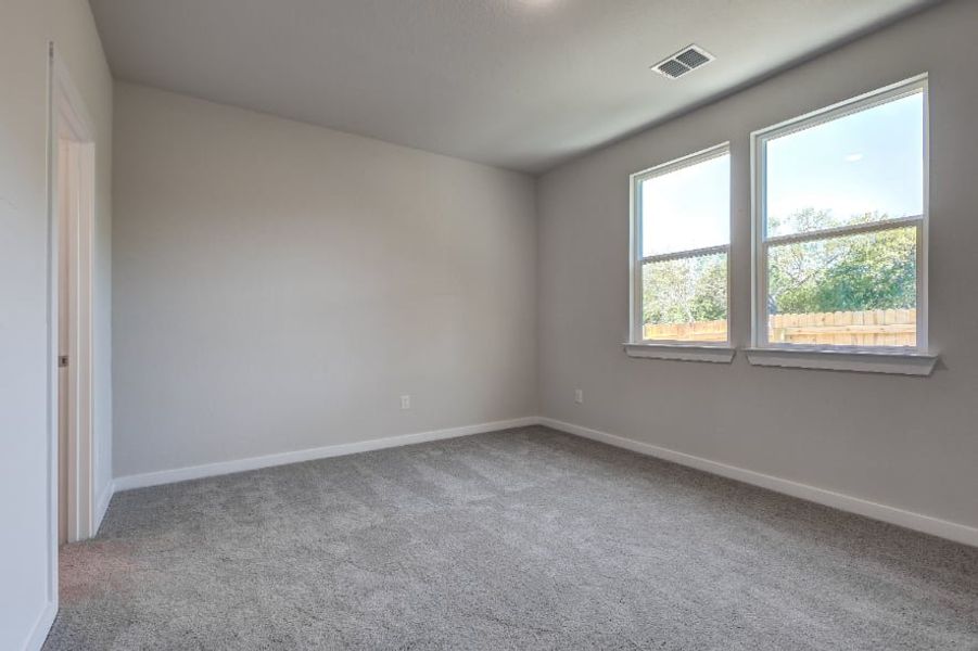 A room with windows and a carpet. A room with windows and a carpet.