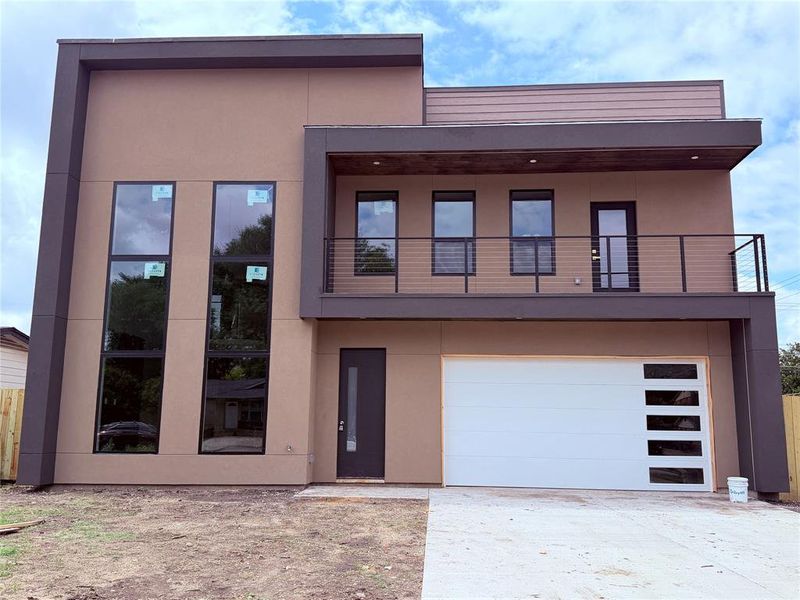 Front exterior of a new home in , Dallas, TX, highlighting curb appeal (Image 13).