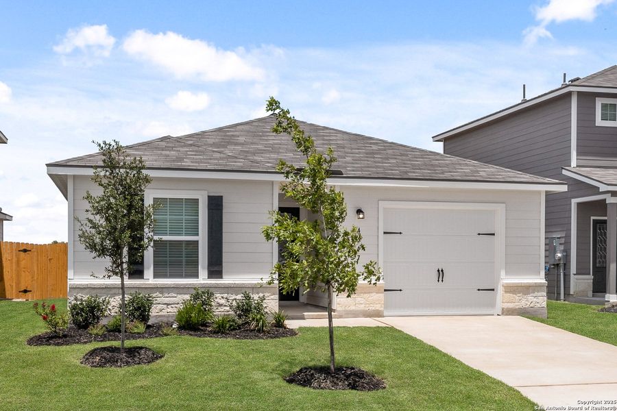 Front exterior of a new home in Blue Wing, San Antonio, TX, highlighting curb appeal (Image 13). Front exterior of a new home in Blue Wing, San Antonio, TX, highlighting curb appeal (Image 13).
