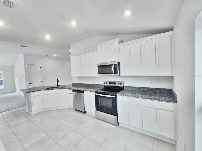 Furnished interior view inside a new home in Harmony Central, St. Cloud (Image 6).