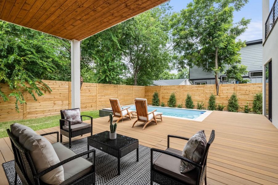 A private outdoor oasis awaits with a glistening pool and expansive deck. A private outdoor oasis awaits with a glistening pool and expansive deck.