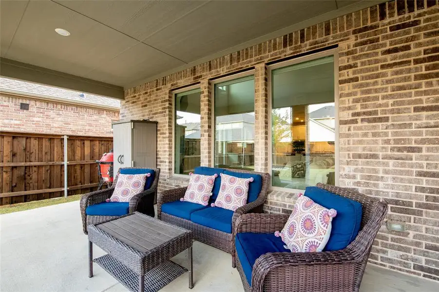 Enjoy outdoor living year-round from the upgraded extended covered patio, offering the perfect setting for morning coffee, weekend gatherings, or relaxing evenings. A convenient gas drop is already in place, making it easy to add your future outdoor kitchen or grill. Enjoy outdoor living year-round from the upgraded extended covered patio, offering the perfect setting for morning coffee, weekend gatherings, or relaxing evenings. A convenient gas drop is already in place, making it easy to add your future outdoor kitchen or grill.