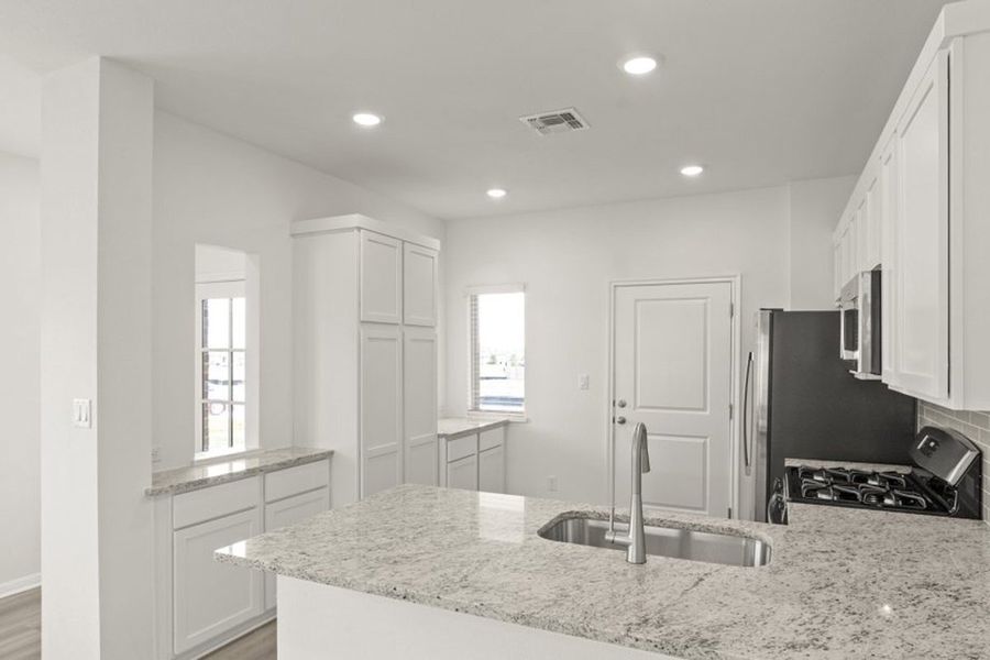 Representative furnished interior of a home built from the Frisco by Pacesetter Homes in Blanco Vista, San Marcos (Image 5).