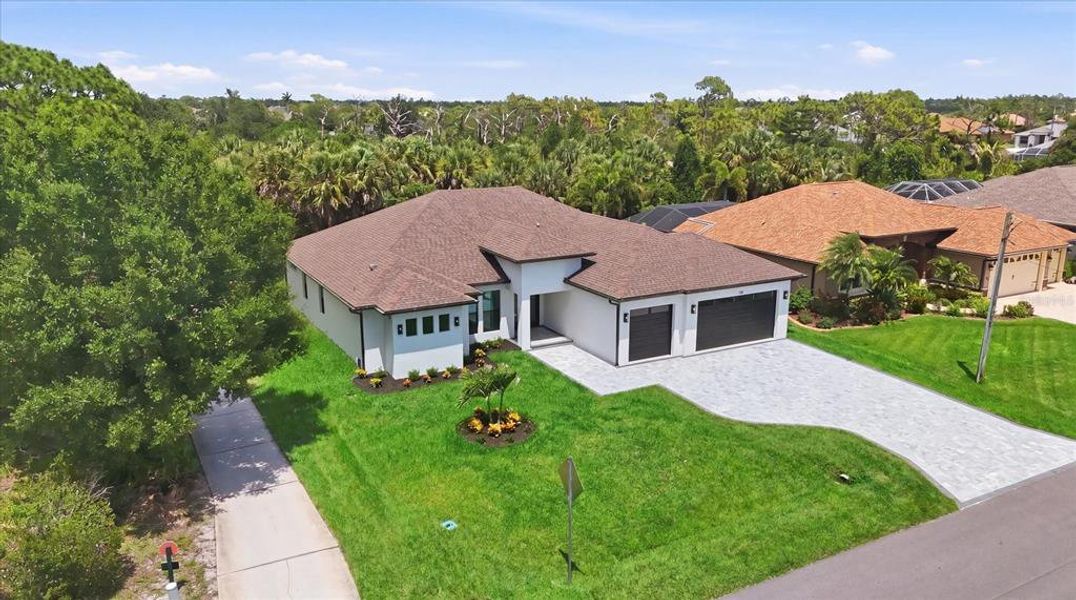 Front exterior of a new home in , Rotonda West, FL, highlighting curb appeal (Image 26).