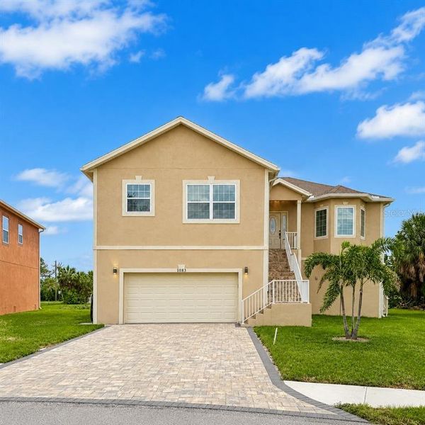 Front exterior of a new home in , Tarpon Springs, FL, highlighting curb appeal (Image 24). Front exterior of a new home in , Tarpon Springs, FL, highlighting curb appeal (Image 24).