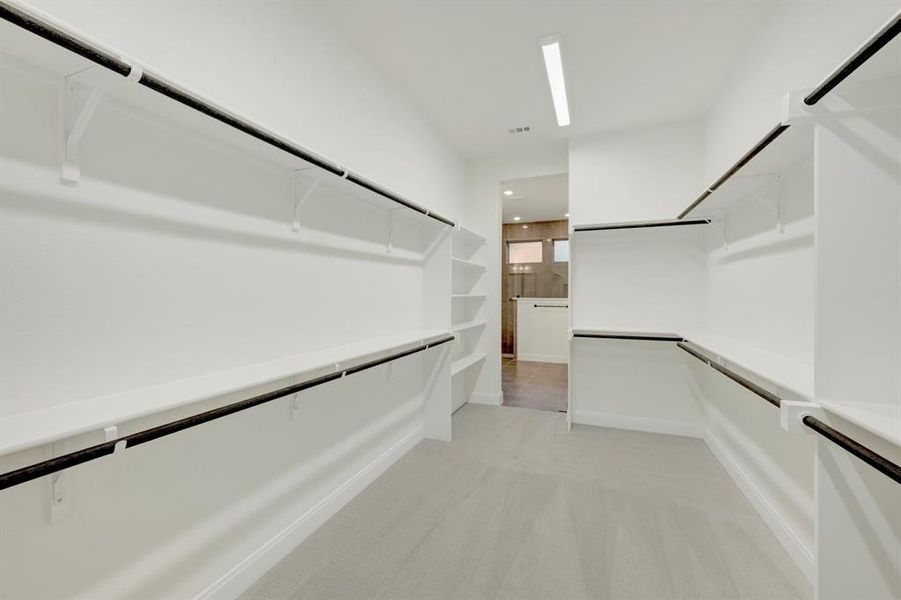 Walk in closet with light carpet Walk in closet with light carpet