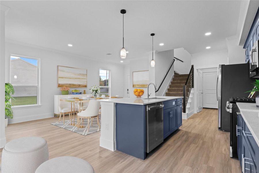 What a view of the bright and cheerful casual dining and gourmet kitchen.  Down the hallway to the left, you will discover the half bathroom located in an easy area for company. ** virtual stage**