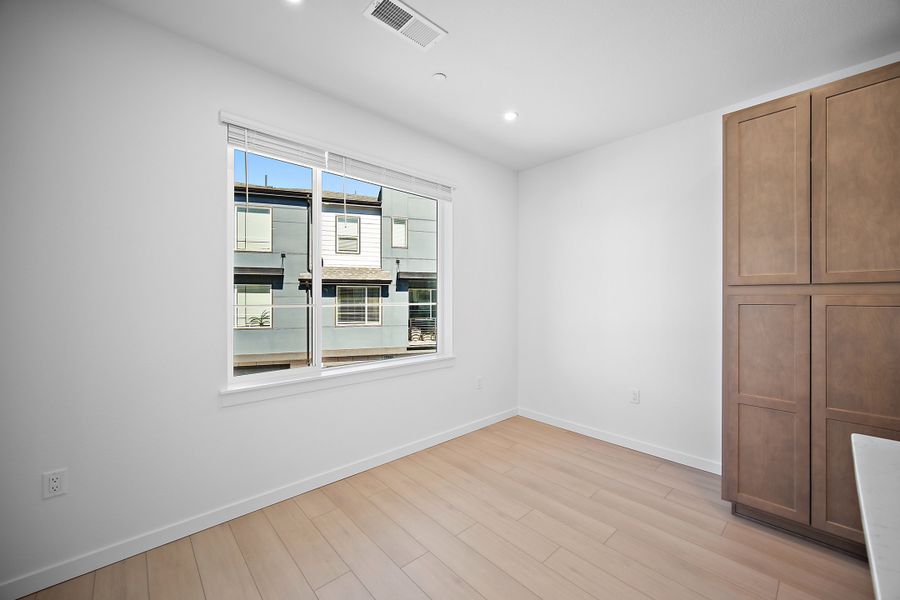 Spacious, unfurnished interior of a new home in Lyric at RidgeGate Townhomes, Lone Tree (Image 14).