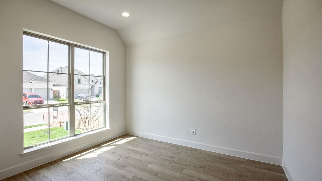 Spare room featuring light wood-style floors and recessed lighting