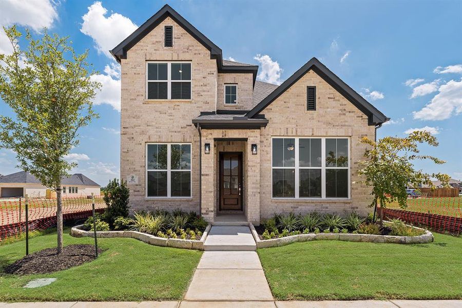 Front exterior of a new home in Cottages of Celina, Celina, TX, highlighting curb appeal (Image 22).