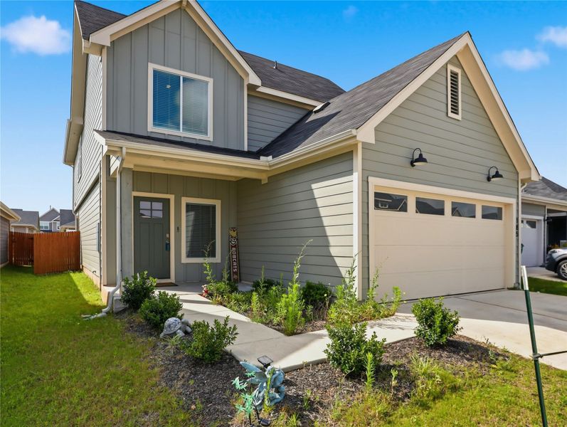 Board and batten accents pair beautifully with horizontal siding on this multi-gabled facade. Board and batten accents pair beautifully with horizontal siding on this multi-gabled facade.