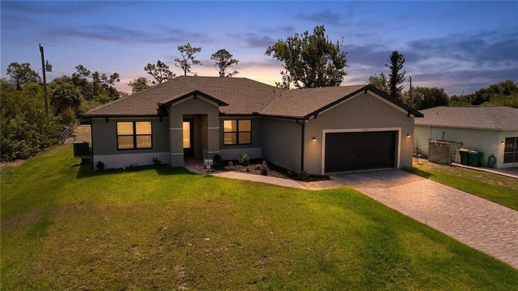 Front exterior of a new home in , Port Charlotte, FL, highlighting curb appeal (Image 26). Front exterior of a new home in , Port Charlotte, FL, highlighting curb appeal (Image 26).
