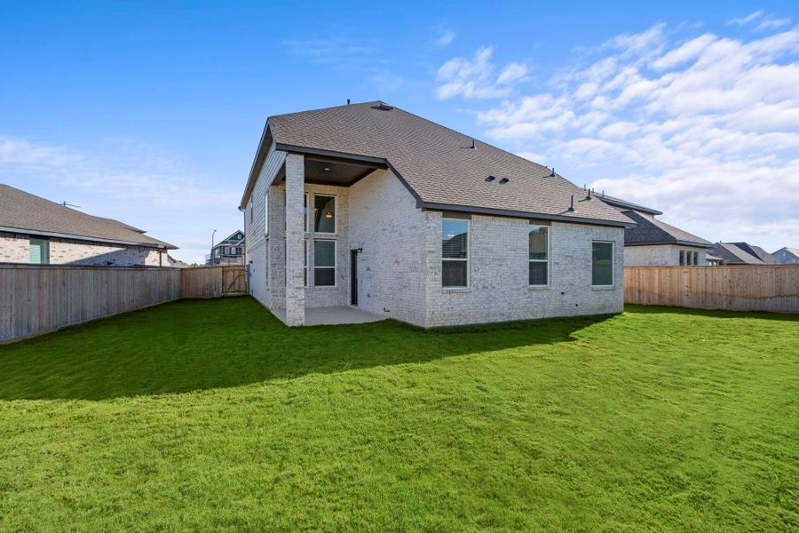Exterior details and patio area of a home in Bridgeland, Cypress (Image 14).