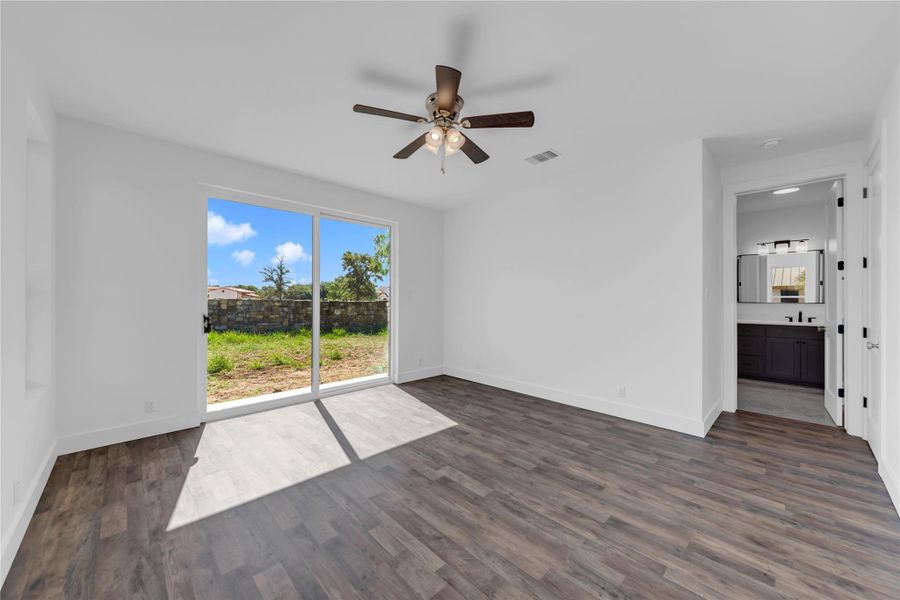 Sliding glass doors open directly to the yard, seamlessly blending indoor and outdoor living.