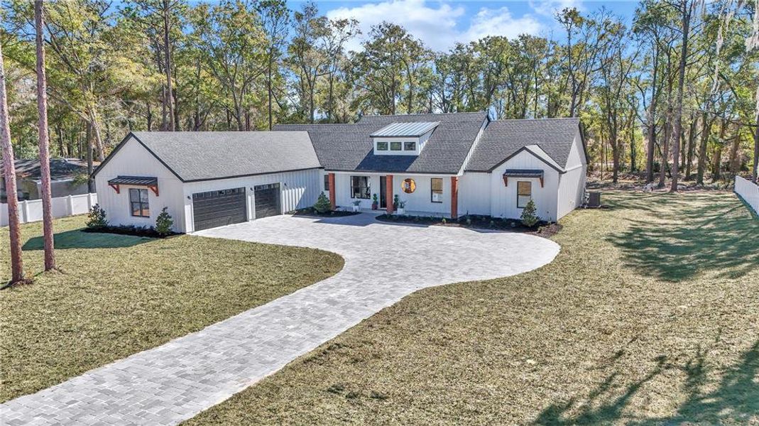 Front exterior of a new home in , Ocala, FL, highlighting curb appeal (Image 2). Front exterior of a new home in , Ocala, FL, highlighting curb appeal (Image 2).