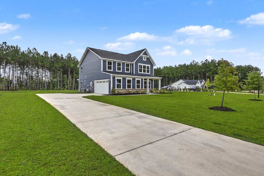 Front exterior of a new home in , Ridgeville, SC, highlighting curb appeal (Image 27). Front exterior of a new home in , Ridgeville, SC, highlighting curb appeal (Image 27).