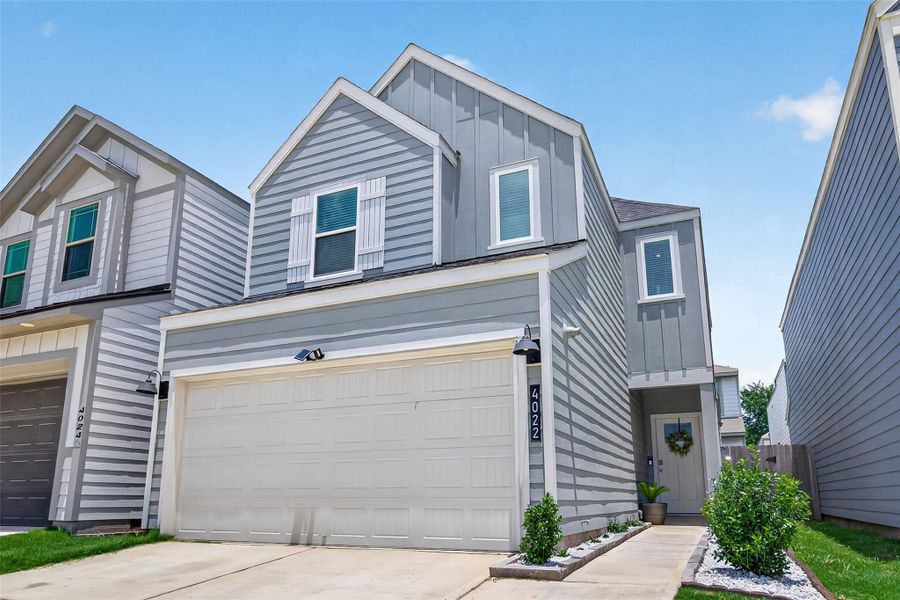 Front exterior of a new home in Antigua, Houston, TX, highlighting curb appeal (Image 20).