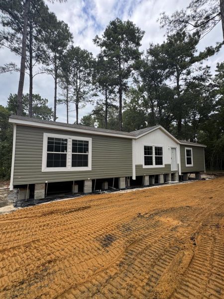 Front exterior of a new home in , Round O, SC, highlighting curb appeal (Image 12).