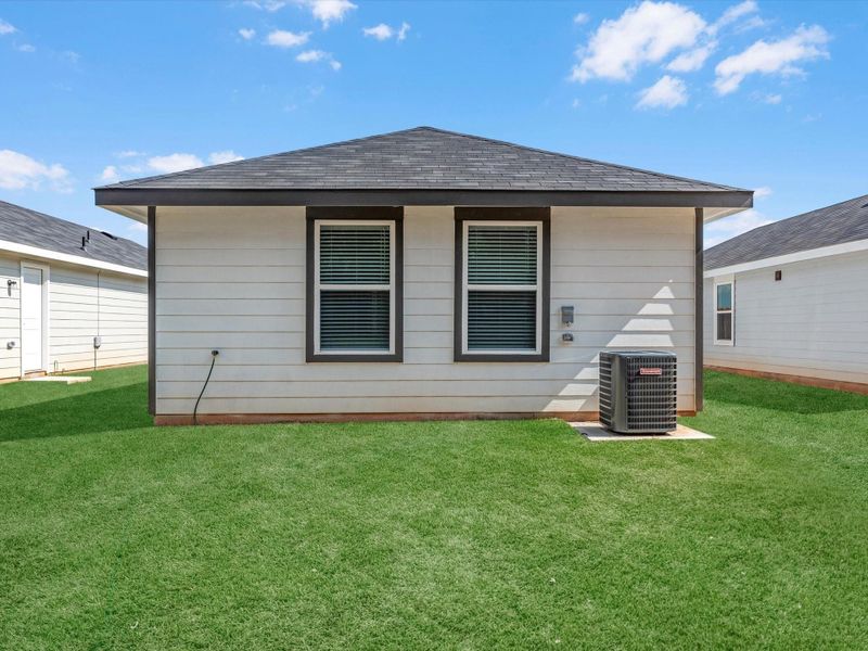 Exterior details and patio area of a home in William Trails, Willis (Image 18).