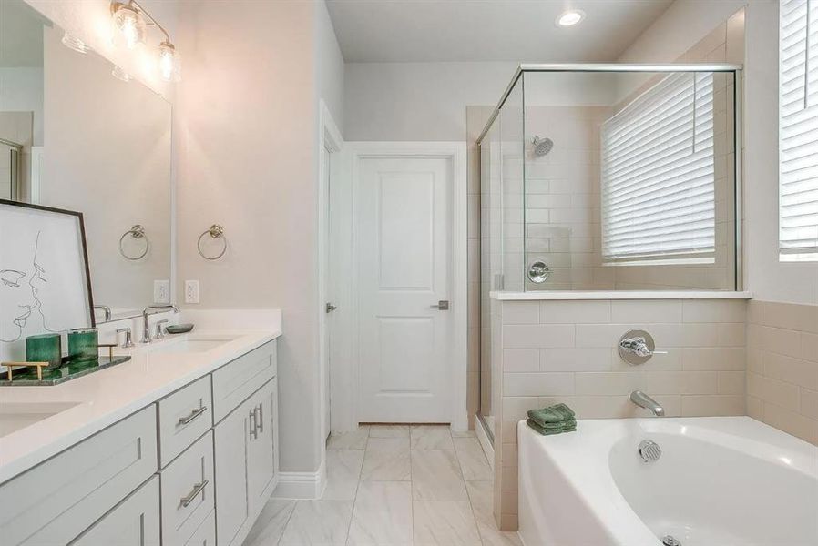 Bathroom with vanity and plus walk in shower