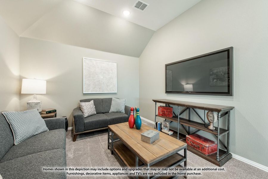 Living room with vaulted ceiling, wall-mounted TV, gray sofas, and wood coffee table on carpet
