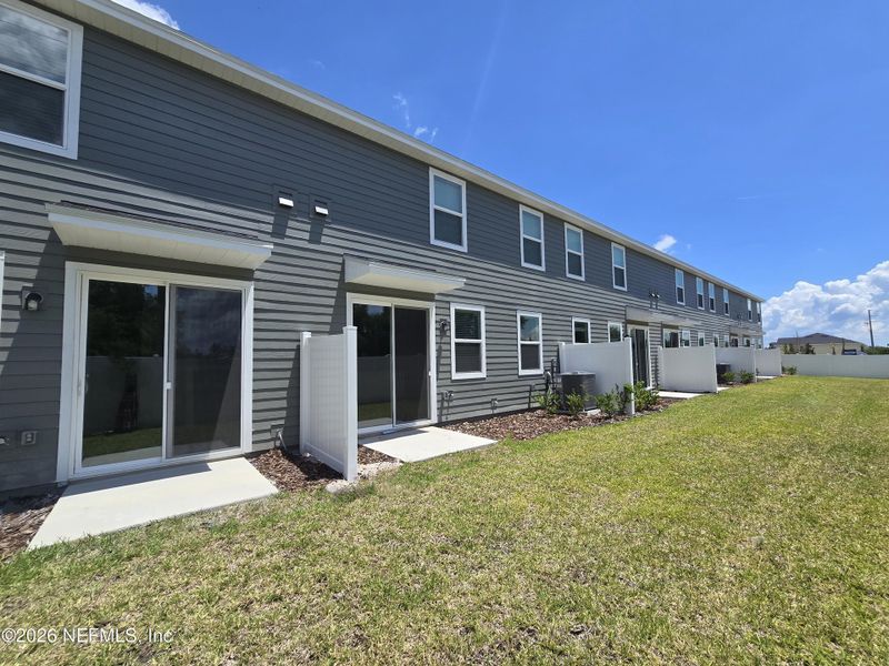 Exterior details and patio area of a home in The District at Oakleaf - The Grove, Middleburg (Image 3).