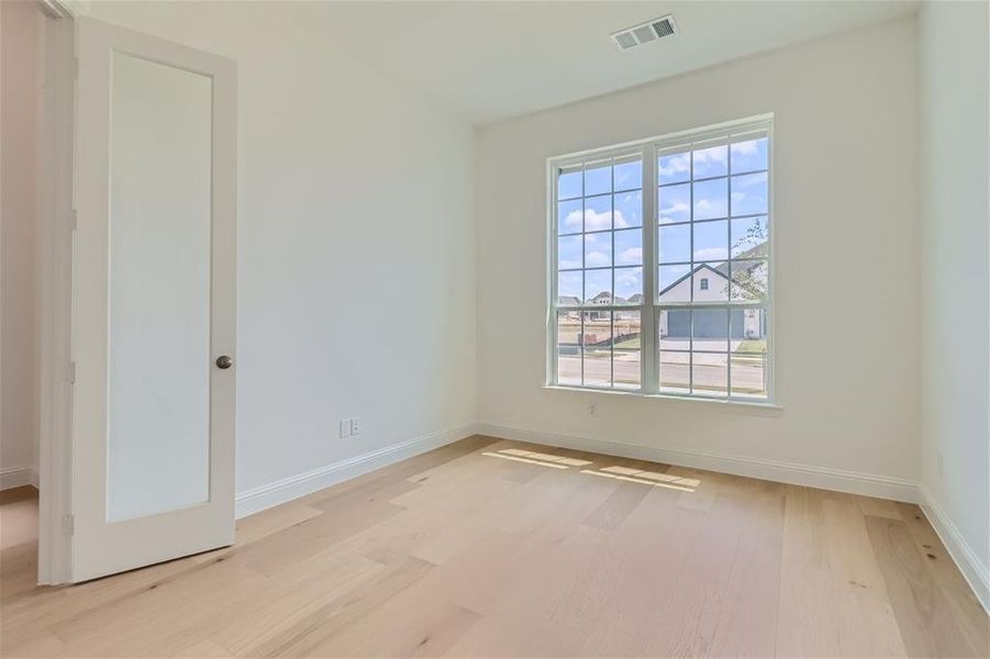 Unfurnished room featuring light hardwood / wood-style floors