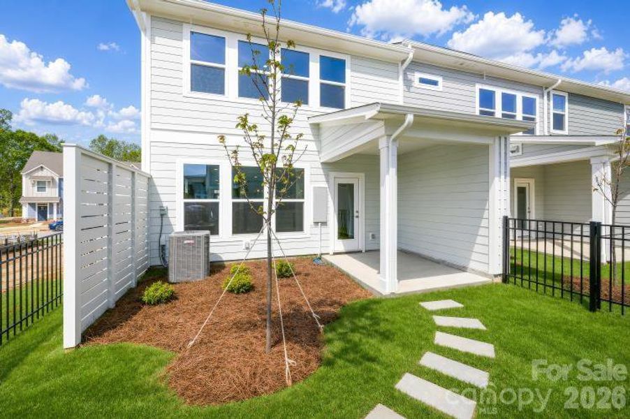 Exterior details and patio area of a home in North Creek Village - Townhomes, Huntersville (Image 15).