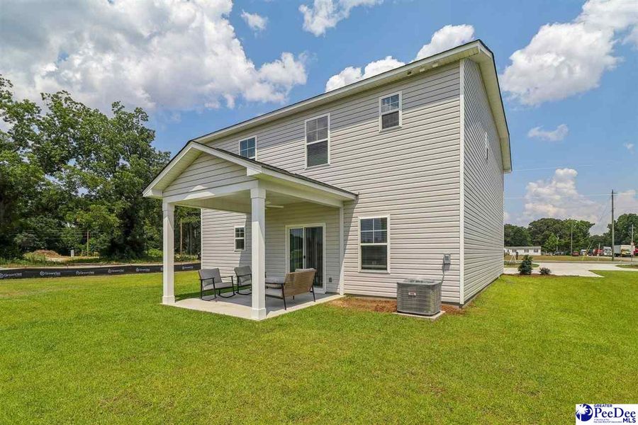 Front exterior of a new home in Southern Columns, Florence, SC, highlighting curb appeal (Image 27).